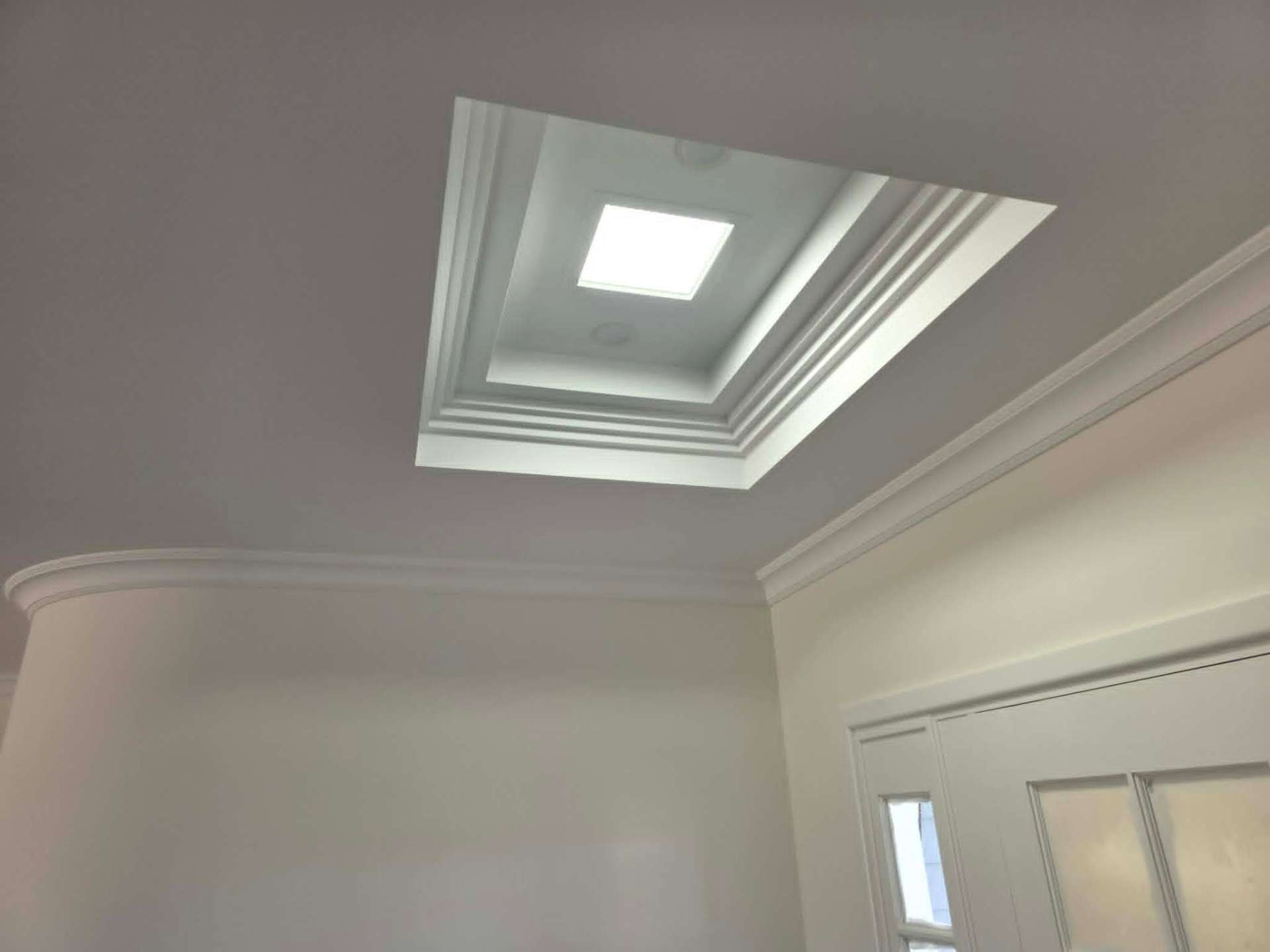 Stepped skylight reveal with layered cornice detail in a Ballarat room