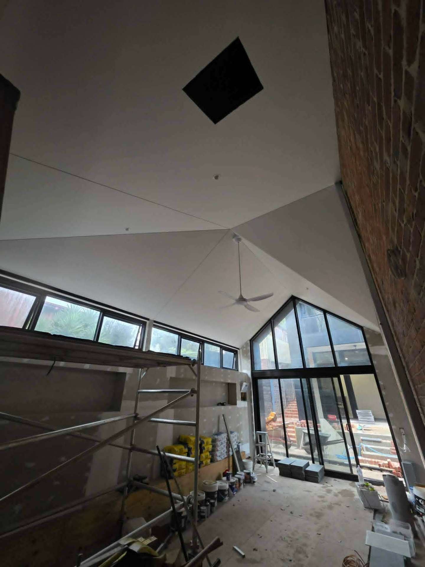 Freshly set raked ceiling above a new-build Ballarat living room by Elevate Plastering