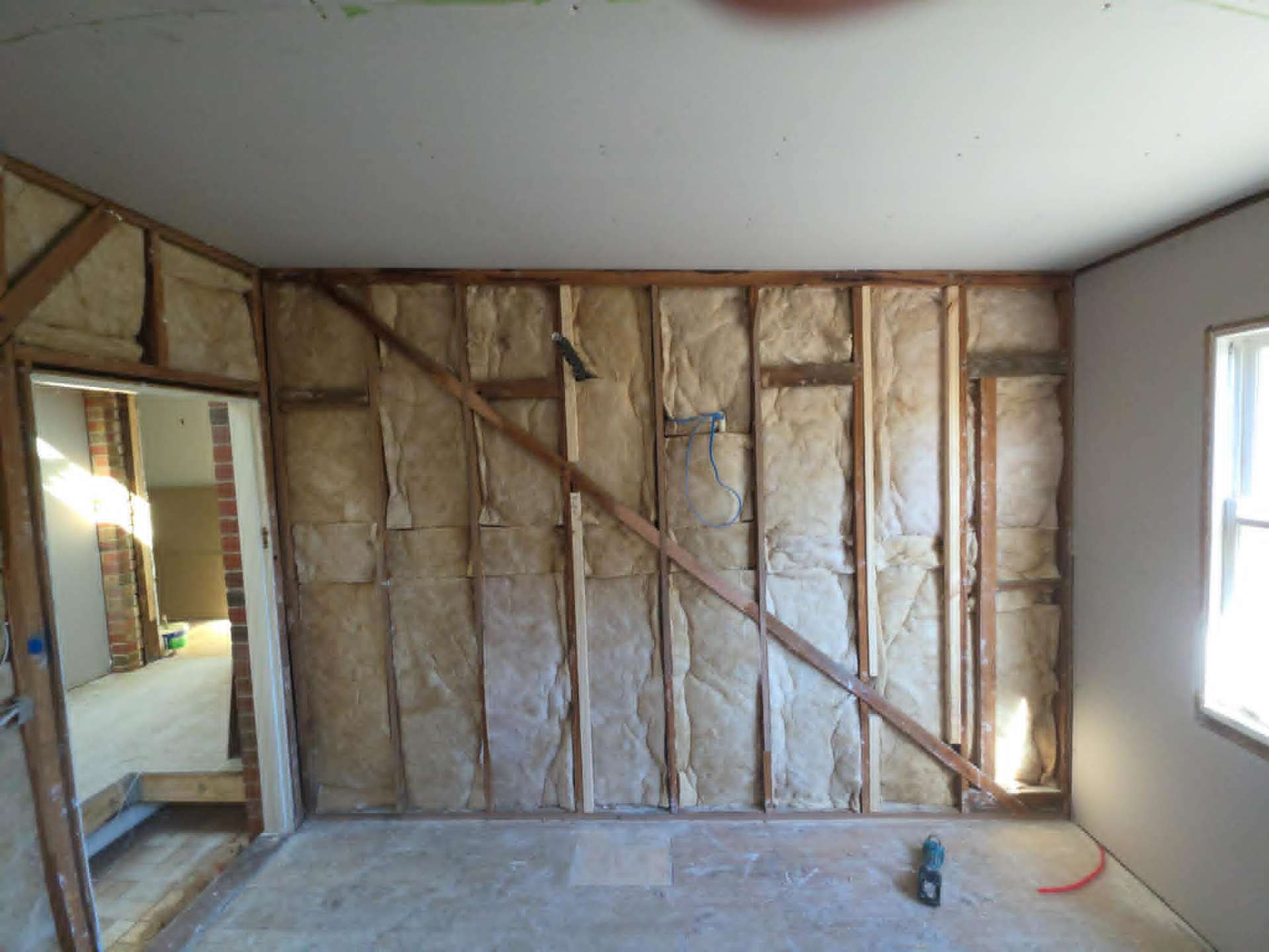 Interior wall stripped back to timber studs during a heritage-home renovation in Ballarat